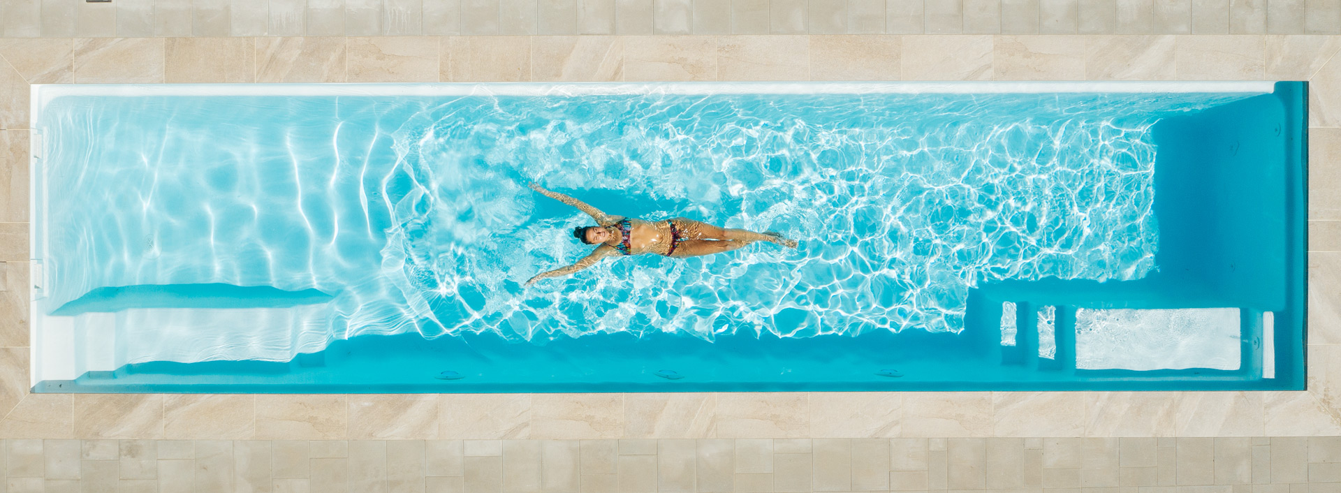 Fibreglass Lap Pool with woman swimming