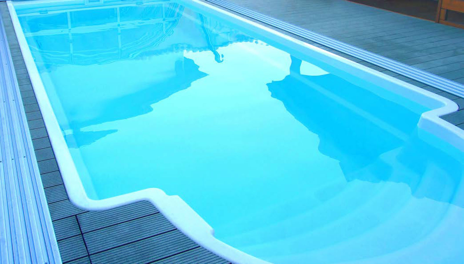 kapri plain finish medium-size fibreglass swimming pool sold in the united kingdom by my pool direct